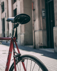 Close-up of bicycle parked on street