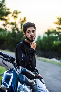 Portrait of young man riding horse