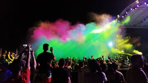 Crowd during music concert at night