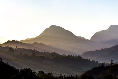 Scenic view of silhouette mountains against clear sky