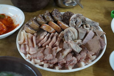 High angle view of meat in plate on table