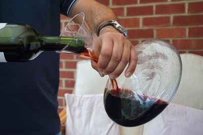 Close-up of man holding drink