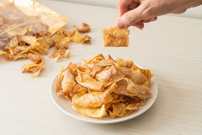 Close-up of person preparing food on table