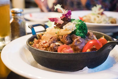 Food in cooking pan on table