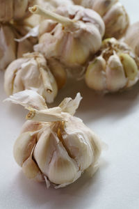 Close-up of garlic bulbs on table