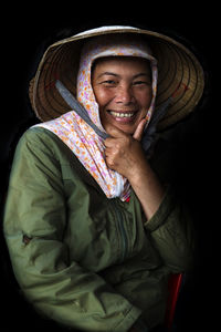 Close-up of woman standing against wall