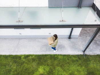 Low section of woman walking on street