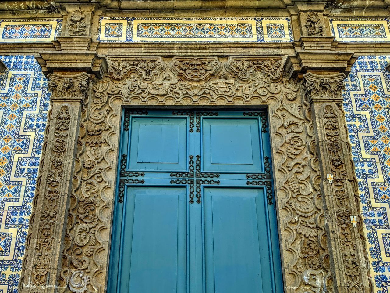 LOW ANGLE VIEW OF CLOSED DOOR OF BUILDING