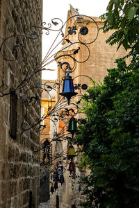 Low angle view of buildings and trees in city