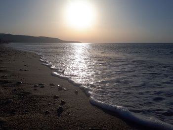 Scenic view of sea against clear sky during sunset