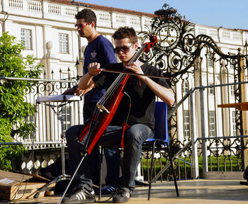 Full length of men playing at observation point