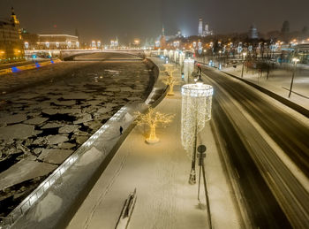 Aerial view of illuminated city during winter
