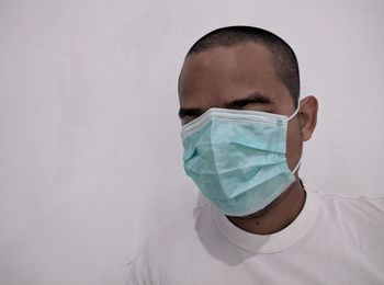 Portrait of young man wearing mask