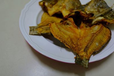 High angle view of meat in plate on table