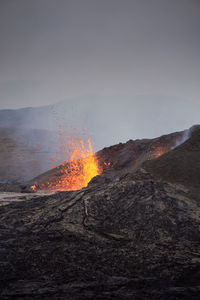 Scenic view of volcanic mountain against sky