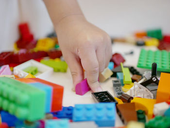 Close-up of hand holding toy toys