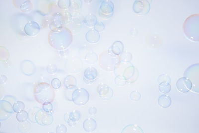 Close-up of bubbles against white background