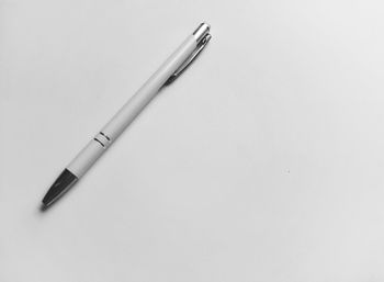 High angle view of pen on table against white background