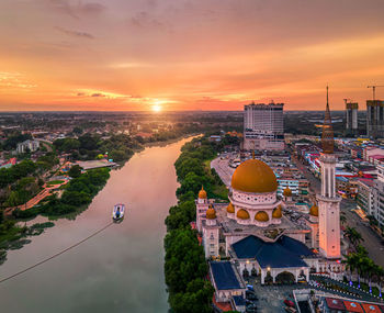 High angle view of city at sunset