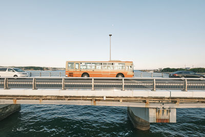 View of bridge over river against clear sky