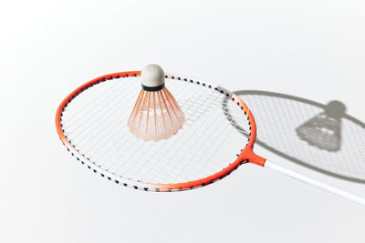 Close-up of basketball hoop against white background