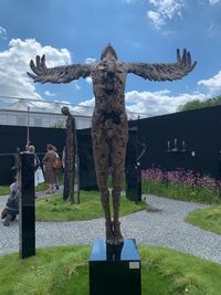 Statue of cemetery against sky