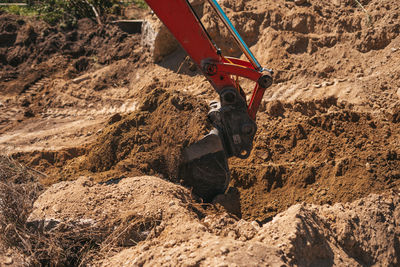 High angle view of man climbing on rock