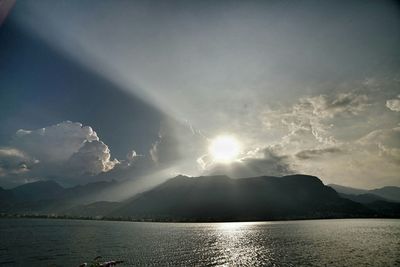 Scenic view of mountains against cloudy sky