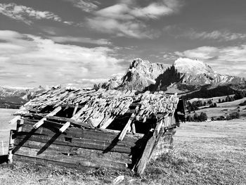Abandoned and ruined hut in the dolomites with a view to sasso piatto and sasso lungo alpe di siusi 