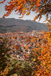 Aerial view of townscape against sky during autumn