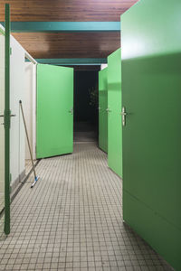 Green doors of toilet in building