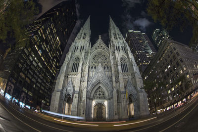 Panoramic view of illuminated buildings in city at night