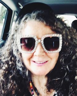 Portrait of smiling girl in car