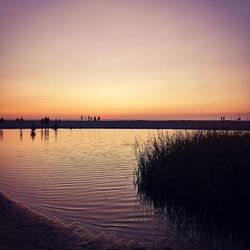 Scenic view of lake against sky during sunset