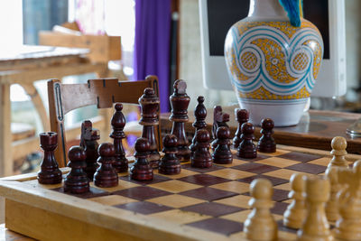 Close-up of chess pieces on table