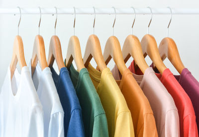 Close-up of multi colored clothes hanging on rack