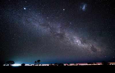 Scenic view of star field against sky at night