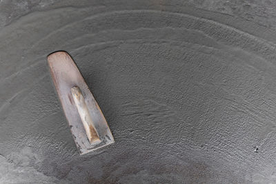 High angle view of abandoned shoe on beach