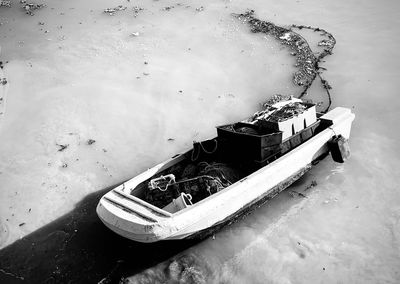 High angle view of boat moored on sea during winter