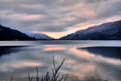 Scenic view of lake against dramatic sky