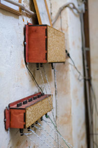 Close-up of electric lamp on wall