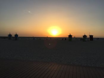 Scenic view of beach against sky during sunset