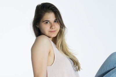 Portrait of a beautiful young woman over white background