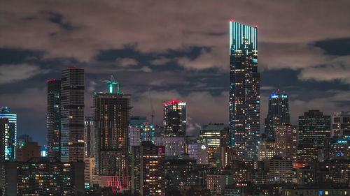 Illuminated buildings in city against sky at night.toronto city,cannada