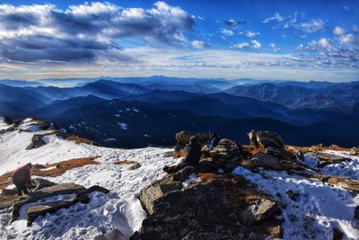 Scenic view of snowcapped mountains against sky