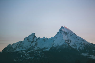 Scenic view of snowcapped mountains against clear sky