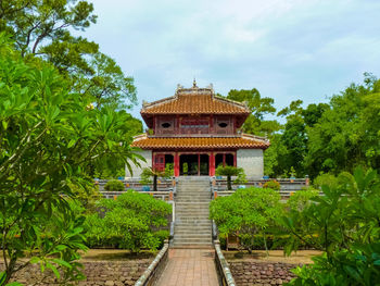 View of temple building against cloudy sky