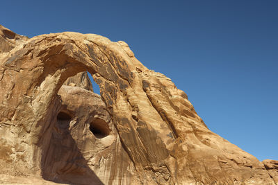 Low angle view of rock formations in desert