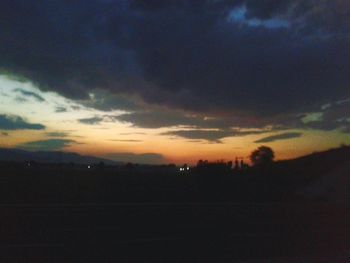 Silhouette of landscape against dramatic sky