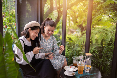 Girls drink coffee relax in cafe ,freelancer communicate on project, working business process.